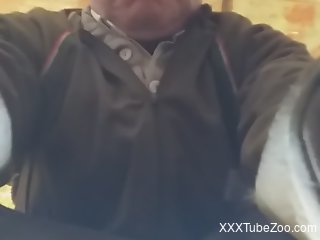 Clothed old man films himself trying anal sex with a dog