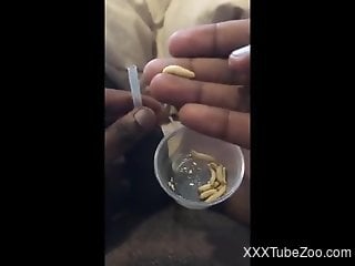 Solo man inserts worms in his black dick for better jerk off